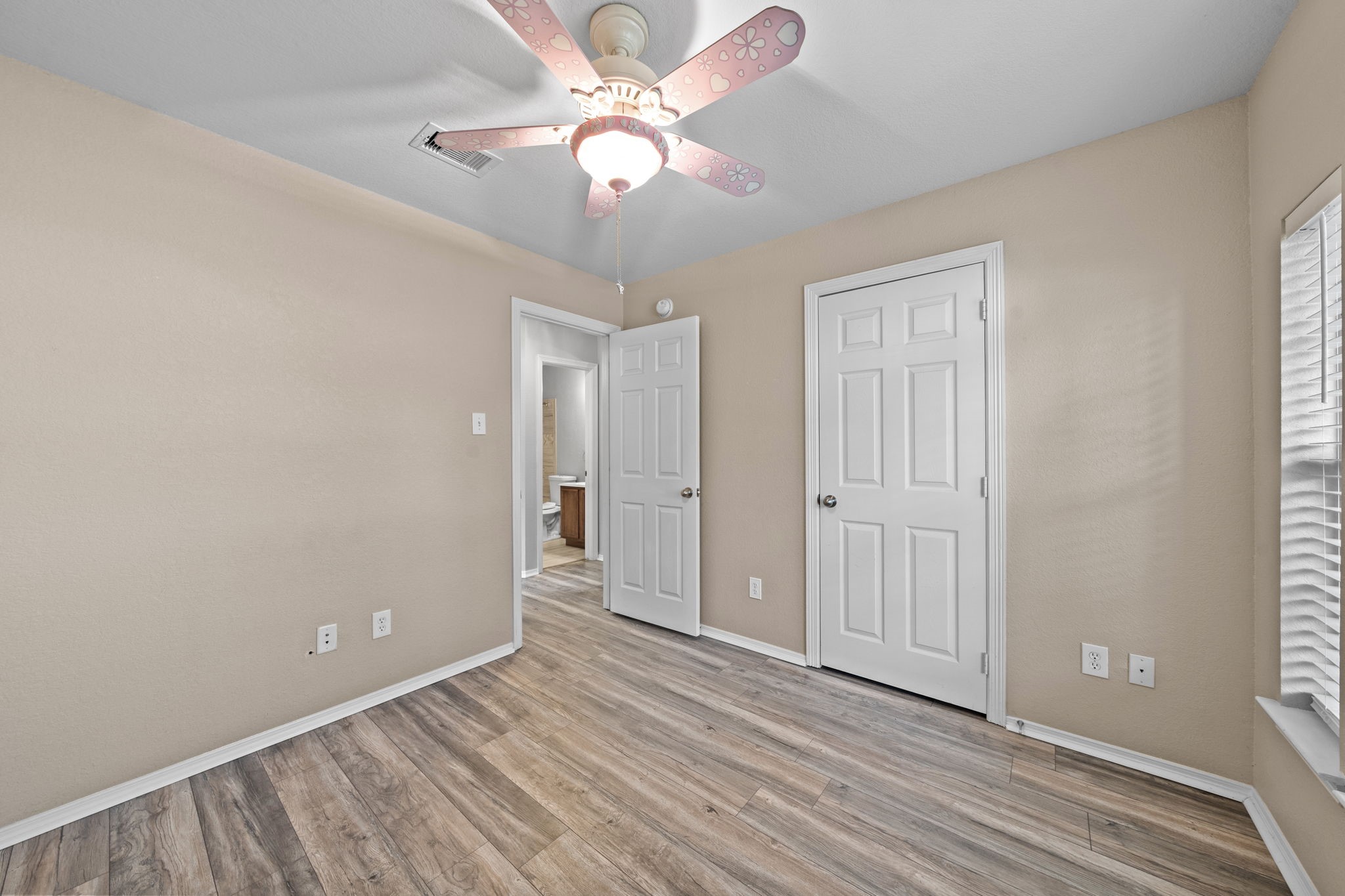 694 St Croix Alvin, TX 77511 - Photo 19 of 30 wooden floor in an empty room with a window