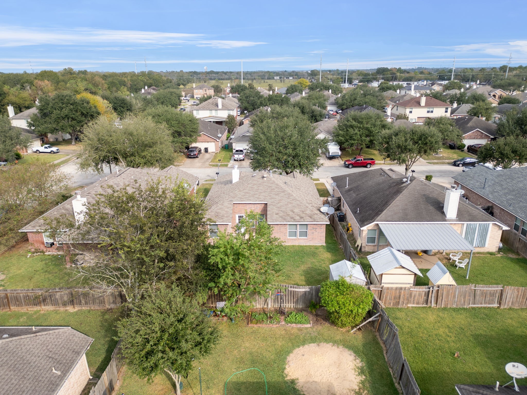 694 St Croix Alvin, TX 77511 - Photo 28 of 30 an aerial view of residential houses with outdoor space and trees