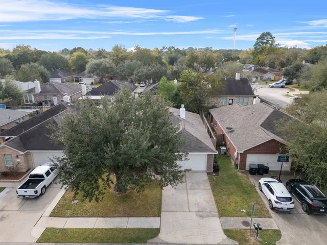 an aerial view of a house with a garden