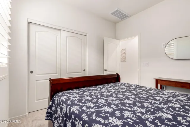 a bedroom with a bed and a cabinets