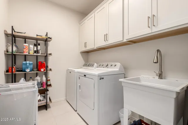 a view of storage and utility room with a sink