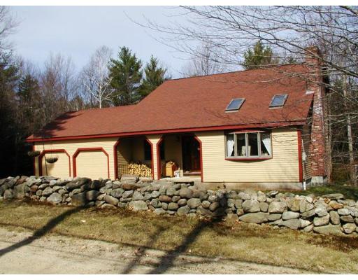 104 Ferin Road Ashburnham, MA 01430 - Photo 1 of 16 a front view of a house with a yard