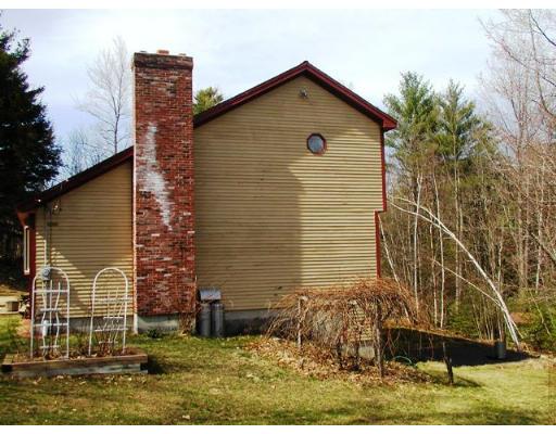 104 Ferin Road Ashburnham, MA 01430 - Photo 3 of 16 a front view of a house with garden