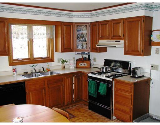104 Ferin Road Ashburnham, MA 01430 - Photo 7 of 16 a kitchen with stainless steel appliances granite countertop a stove a sink dishwasher and a microwave oven with granite countertops
