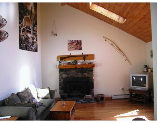 104 Ferin Road Ashburnham, MA 01430 - Photo 9 of 16 a living room with furniture and a fireplace
