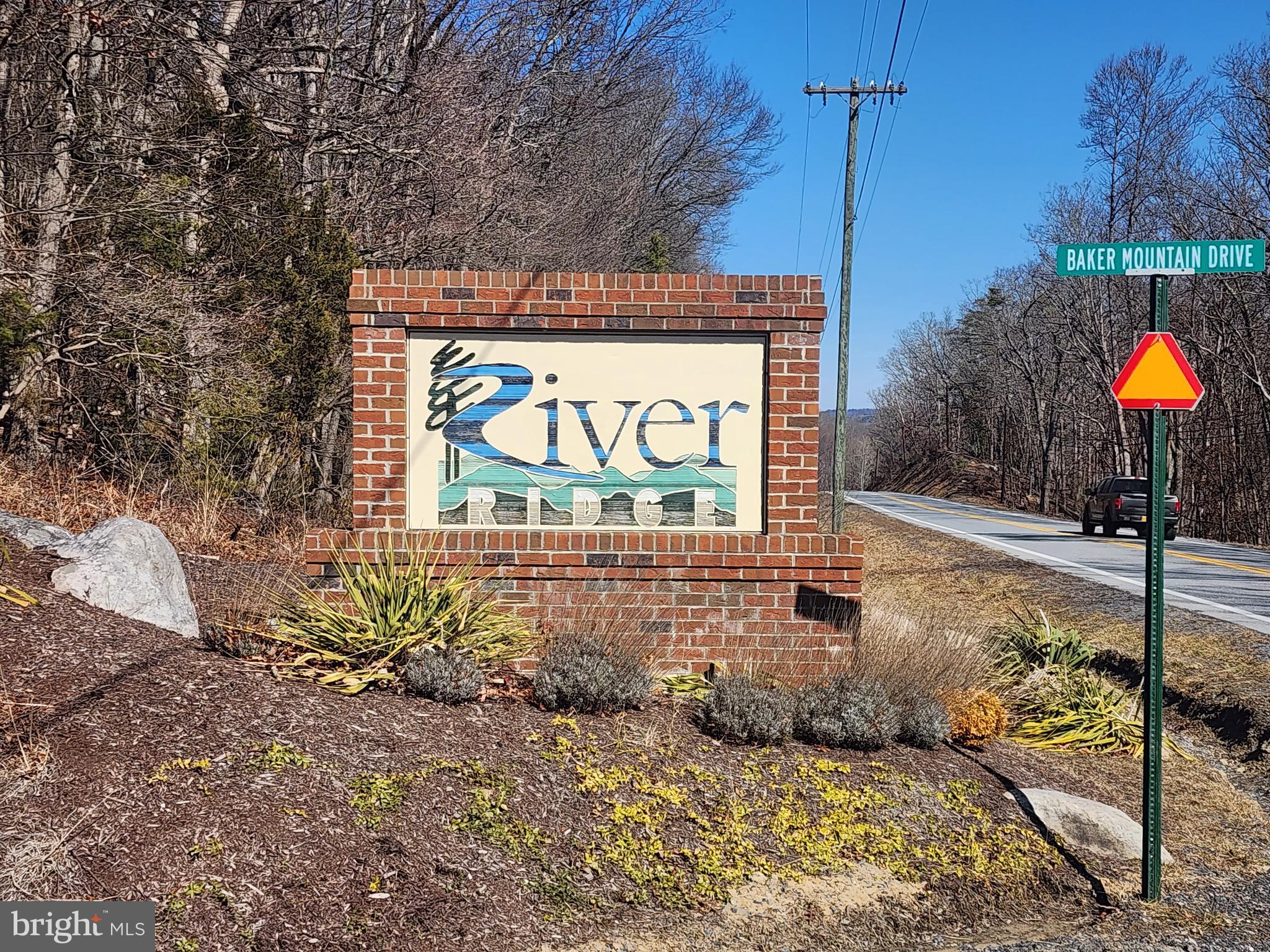 116 River Ridge Yellow Spring, WV 26865 - Photo 32 of 41 a street sign that is on a brick wall
