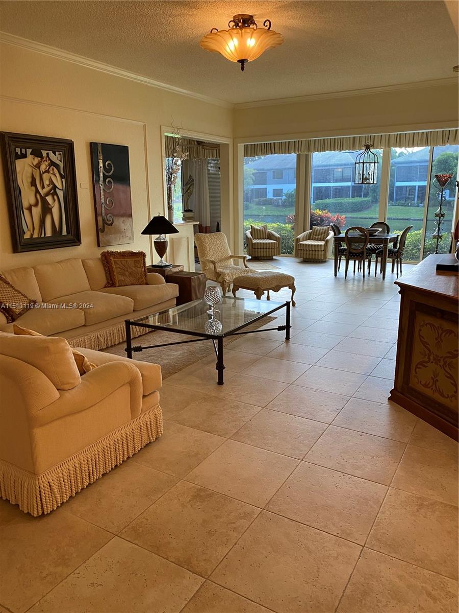 Boca West Boca Raton, FL 33434 - Photo 1 of 28 a living room with furniture and a large window