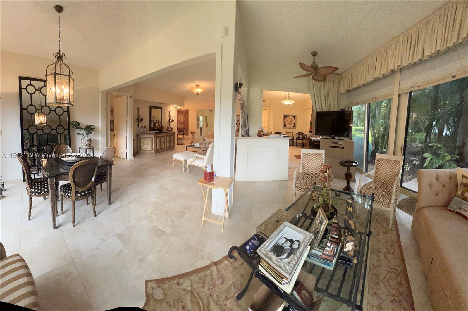 Boca West Boca Raton, FL 33434 - Photo 2 of 28 a view of a dining room and livingroom with furniture wooden floor a chandelier