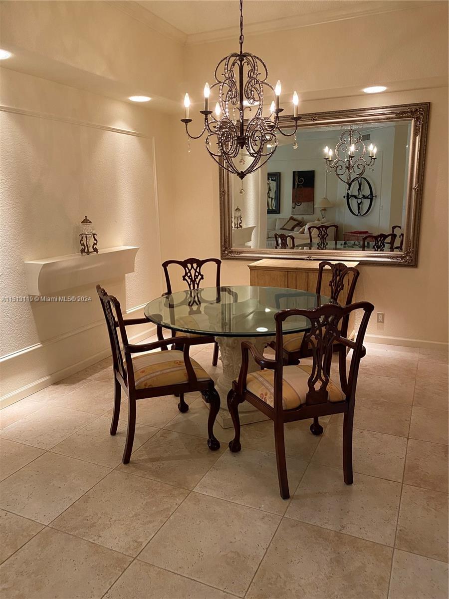 Boca West Boca Raton, FL 33434 - Photo 21 of 28 a view of a dining room with furniture and chandelier