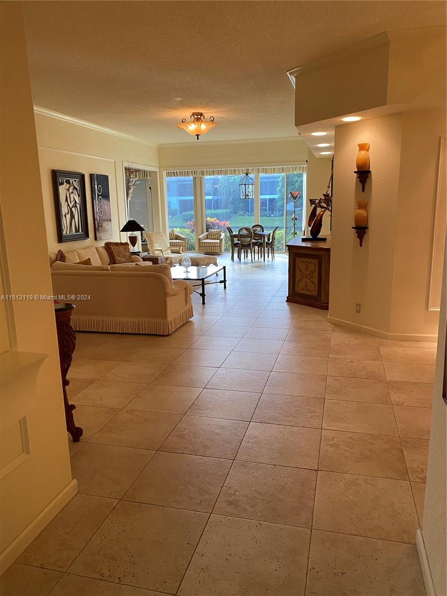Boca West Boca Raton, FL 33434 - Photo 22 of 28 a living room with couches and kitchen view