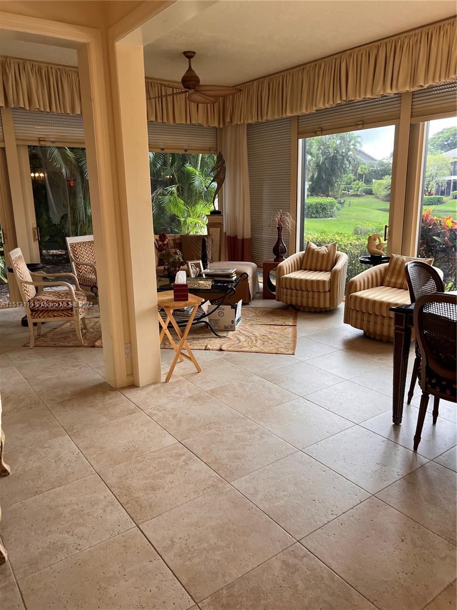 Boca West Boca Raton, FL 33434 - Photo 27 of 28 a living room with furniture and a large window