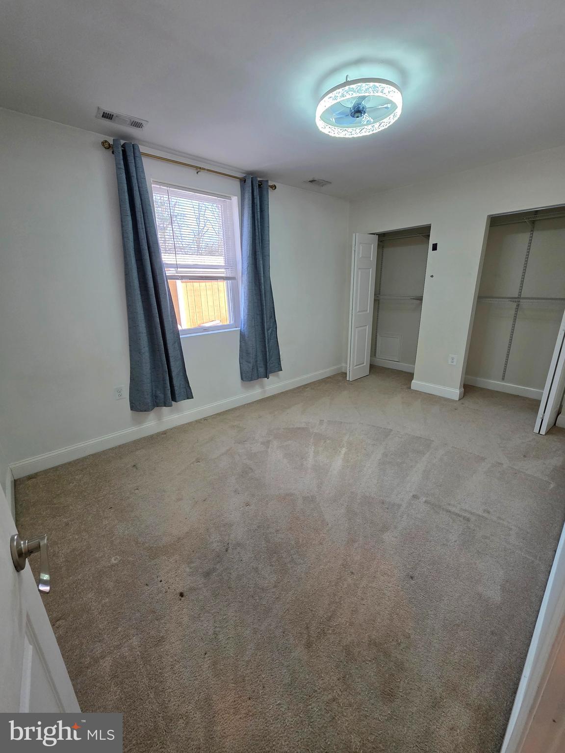 1342 Edna Road Pasadena, MD 21122 - Photo 23 of 31 an empty room with windows and closet