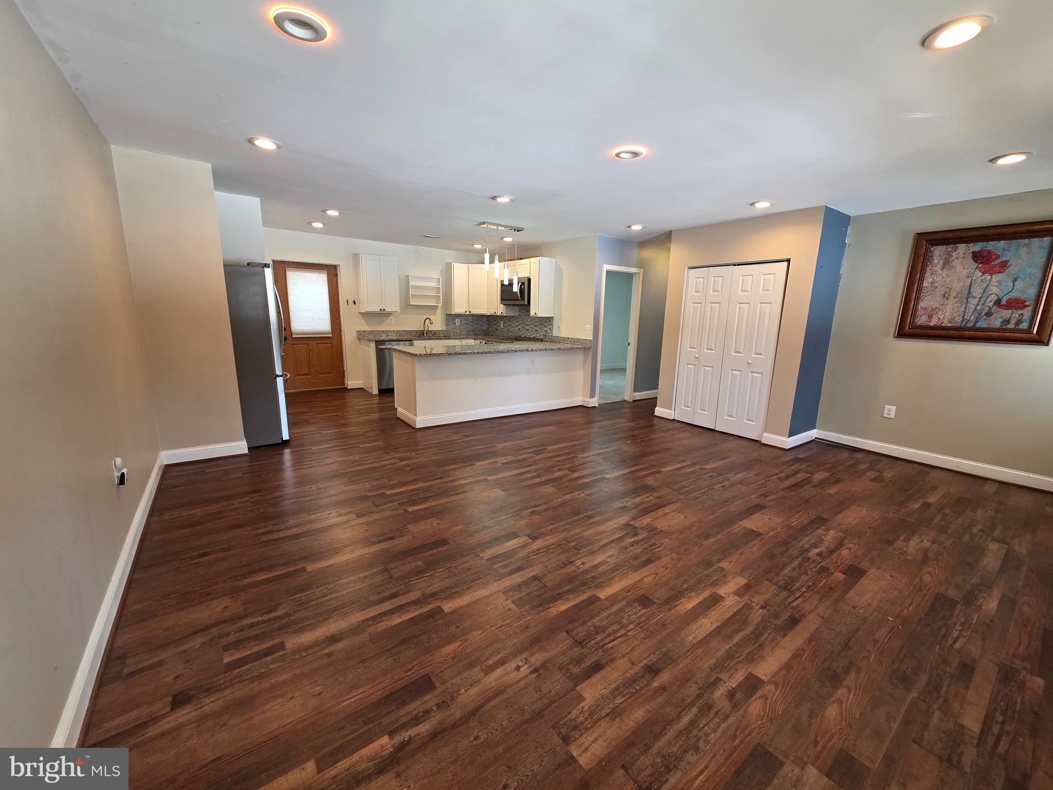 1342 Edna Road Pasadena, MD 21122 - Photo 7 of 31 a view of kitchen with cabinets and wooden floor