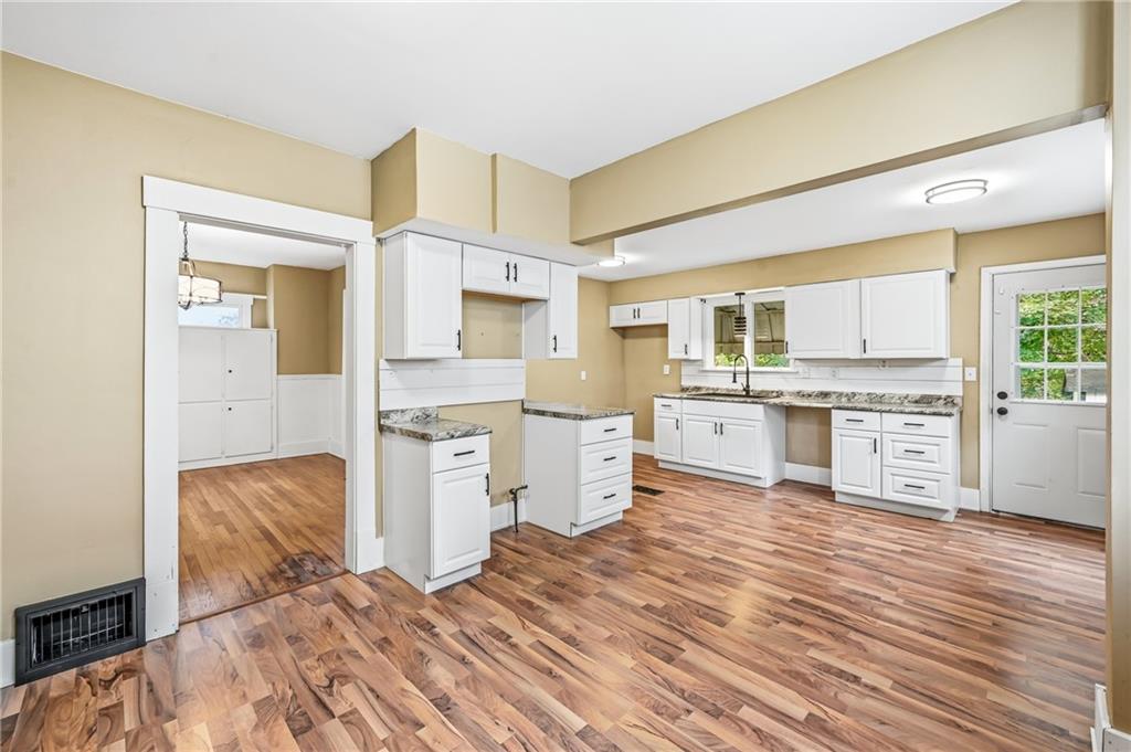 124 Wengler Avenue Sharon, PA 16146 - Photo 11 of 25 a kitchen with a refrigerator and cabinets