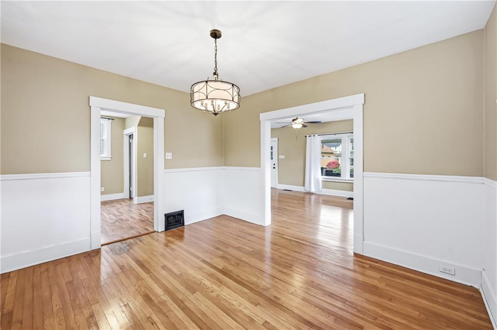 124 Wengler Avenue Sharon, PA 16146 - Photo 12 of 25 a view of empty room with wooden floor and window
