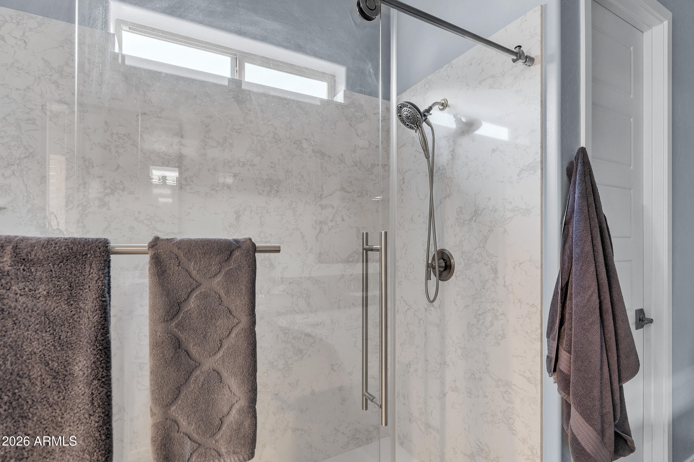 622 West Deer Creek Road Phoenix, AZ 85048 - Photo 25 of 39 a bathroom with a shower and a glass door
