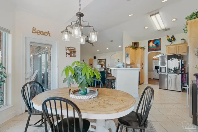 a kitchen with stainless steel appliances granite countertop a stove microwave and refrigerator