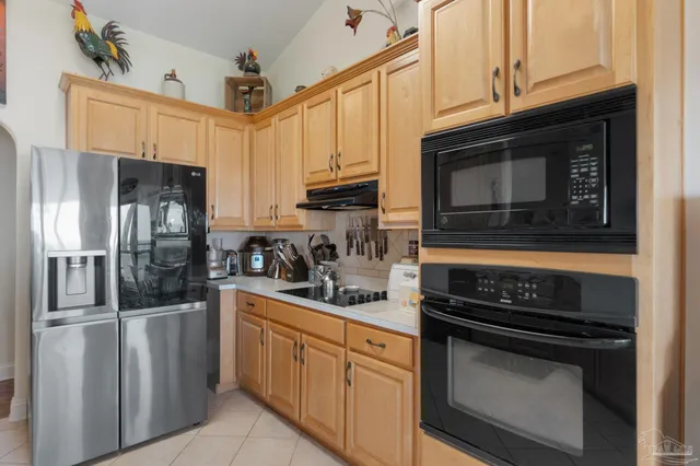 a view of a room with wooden floor and windows