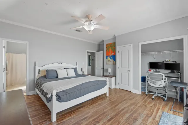 a bedroom with a large bed and a couch