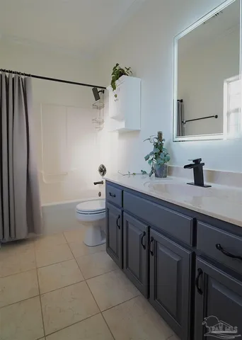 a view of hallway with livingroom and furniture