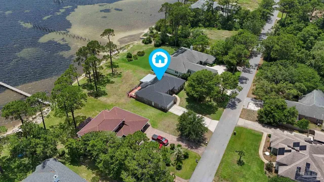 an aerial view of a house with a garden