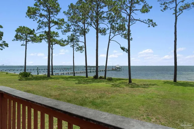 an aerial view of a house with a big yard