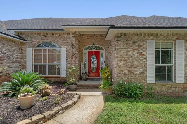 a view of room with workspace and wooden floor