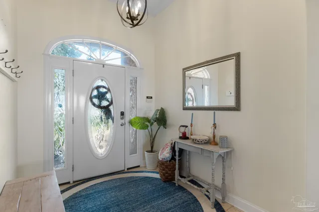 a view of a livingroom with furniture and a ceiling fan