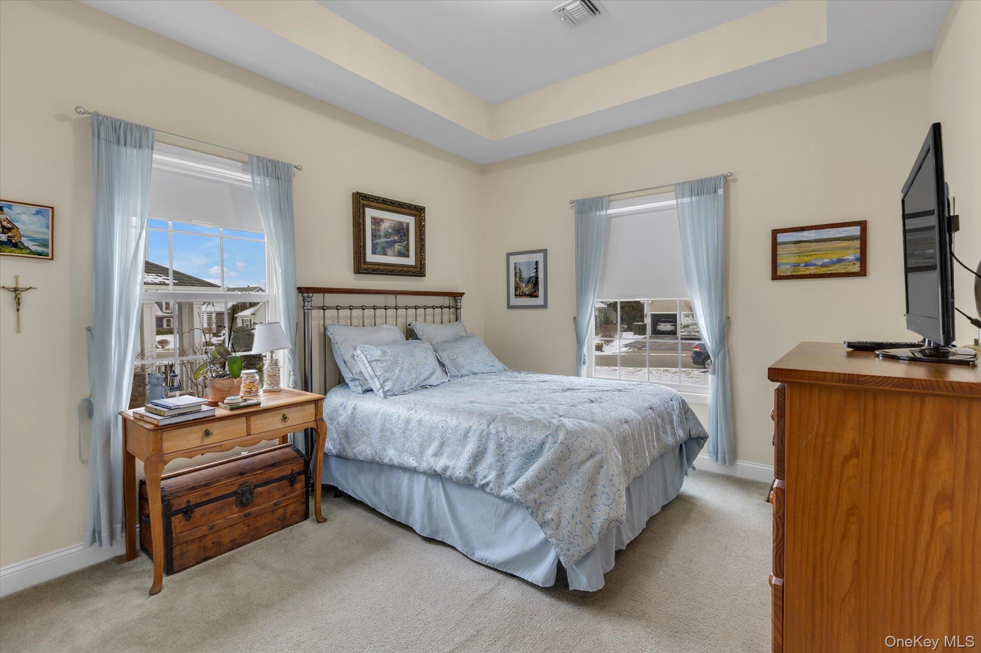 390 Stonecrop Road Riverhead, NY 11901 - Photo 16 of 24 a bedroom with a bed and a night stand