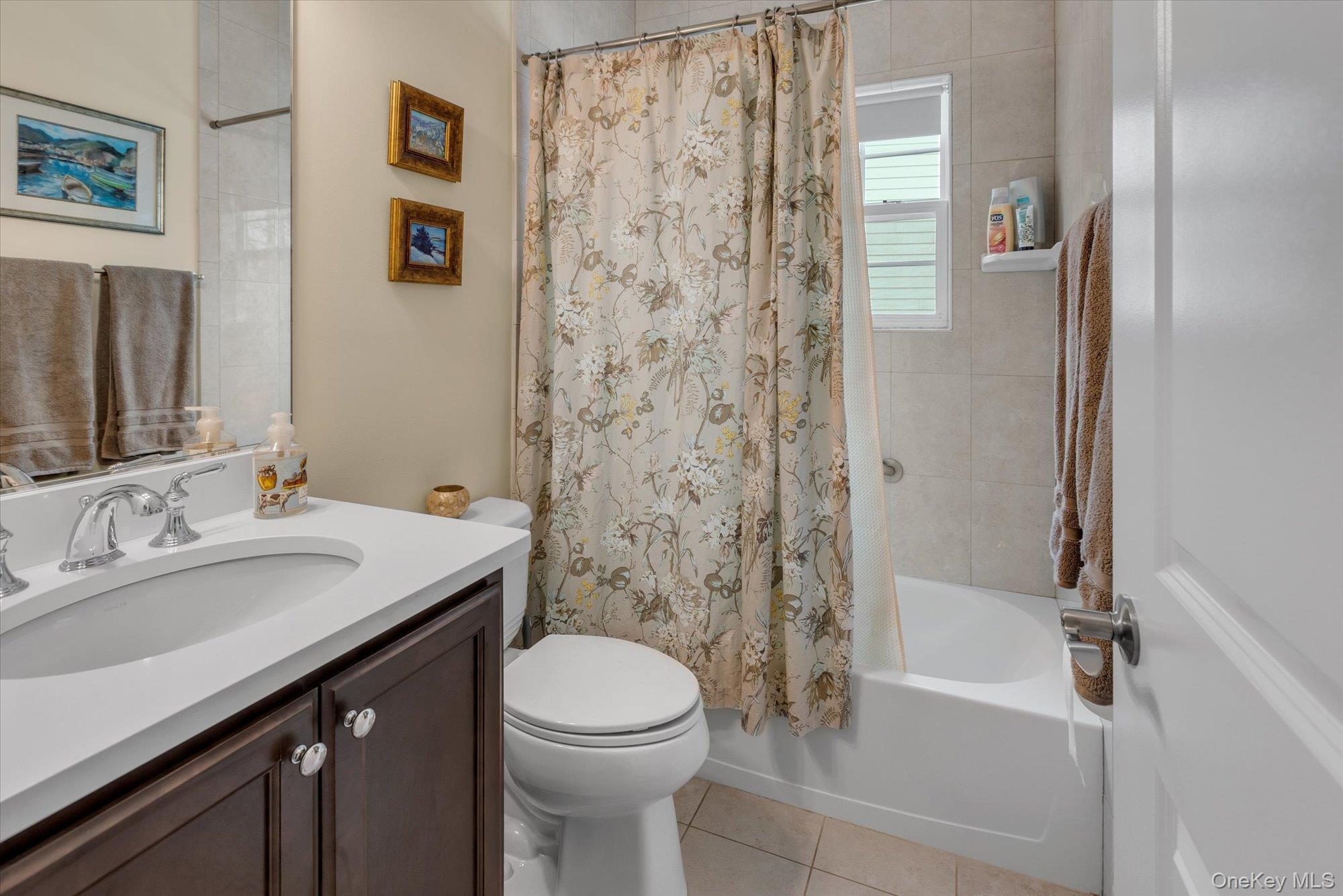 390 Stonecrop Road Riverhead, NY 11901 - Photo 17 of 24 a bathroom with a sink a toilet and shower