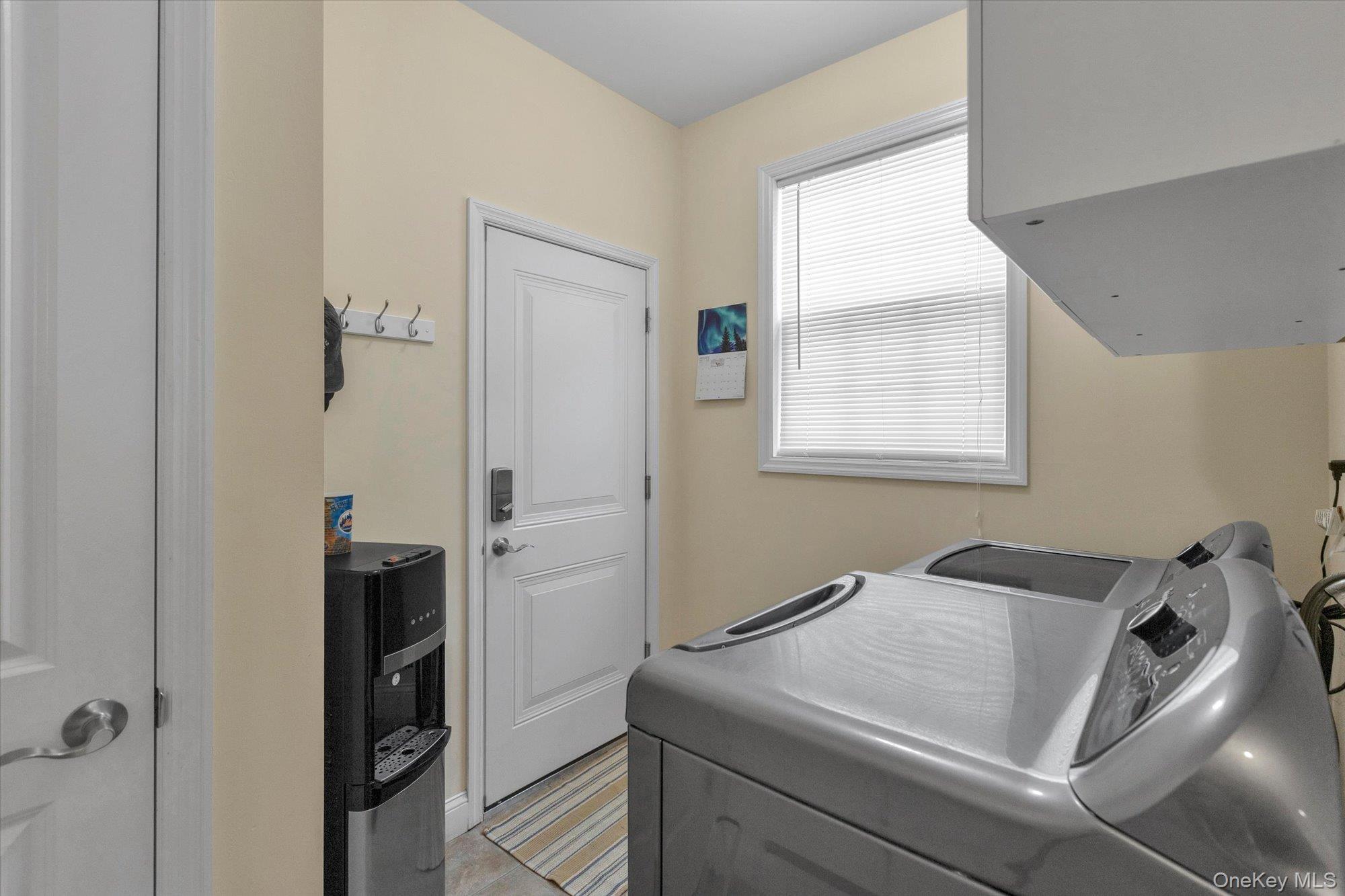 390 Stonecrop Road Riverhead, NY 11901 - Photo 19 of 24 a bathroom with a sink and a shower