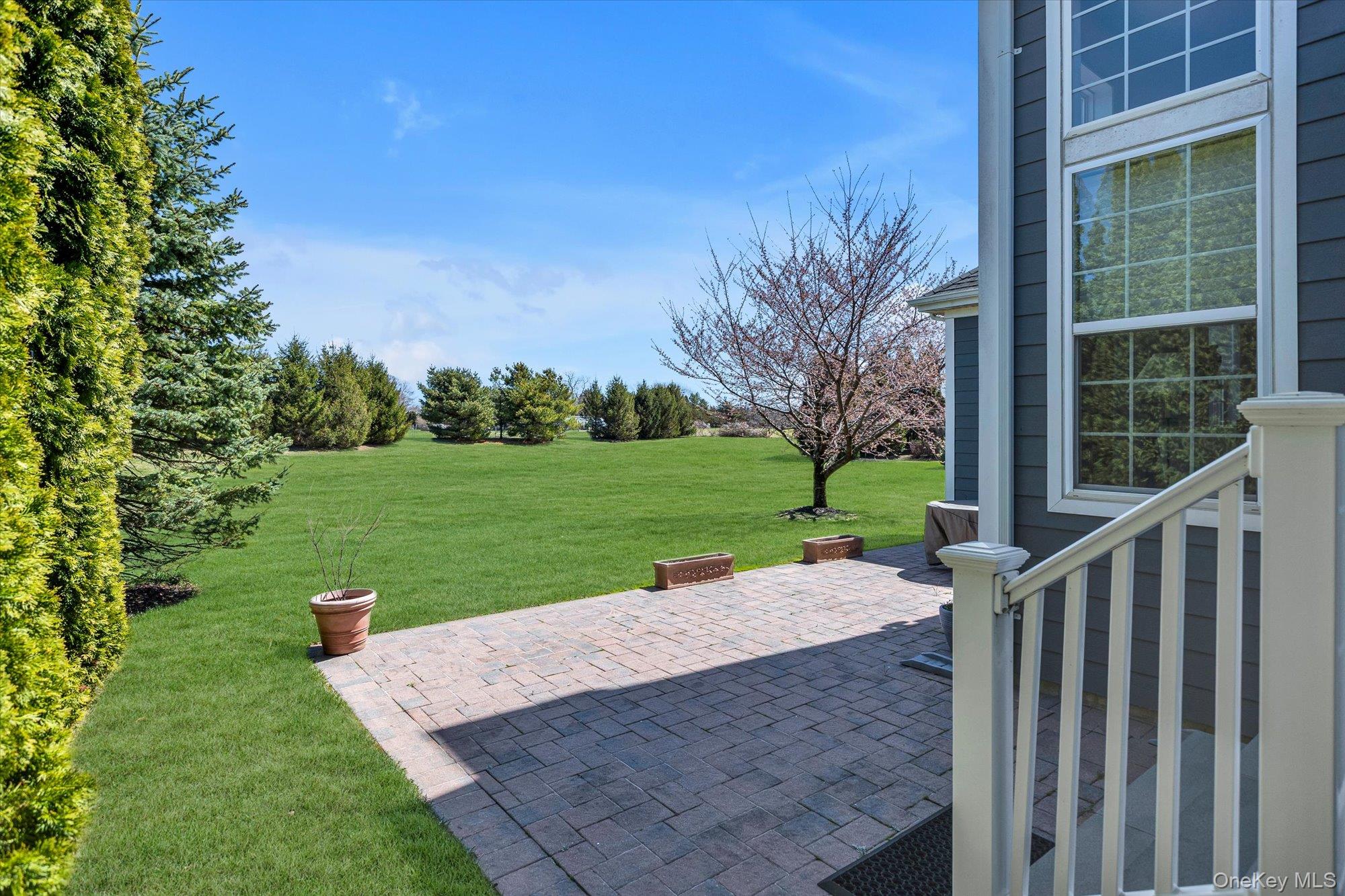 390 Stonecrop Road Riverhead, NY 11901 - Photo 20 of 24 a view of a porch with a yard