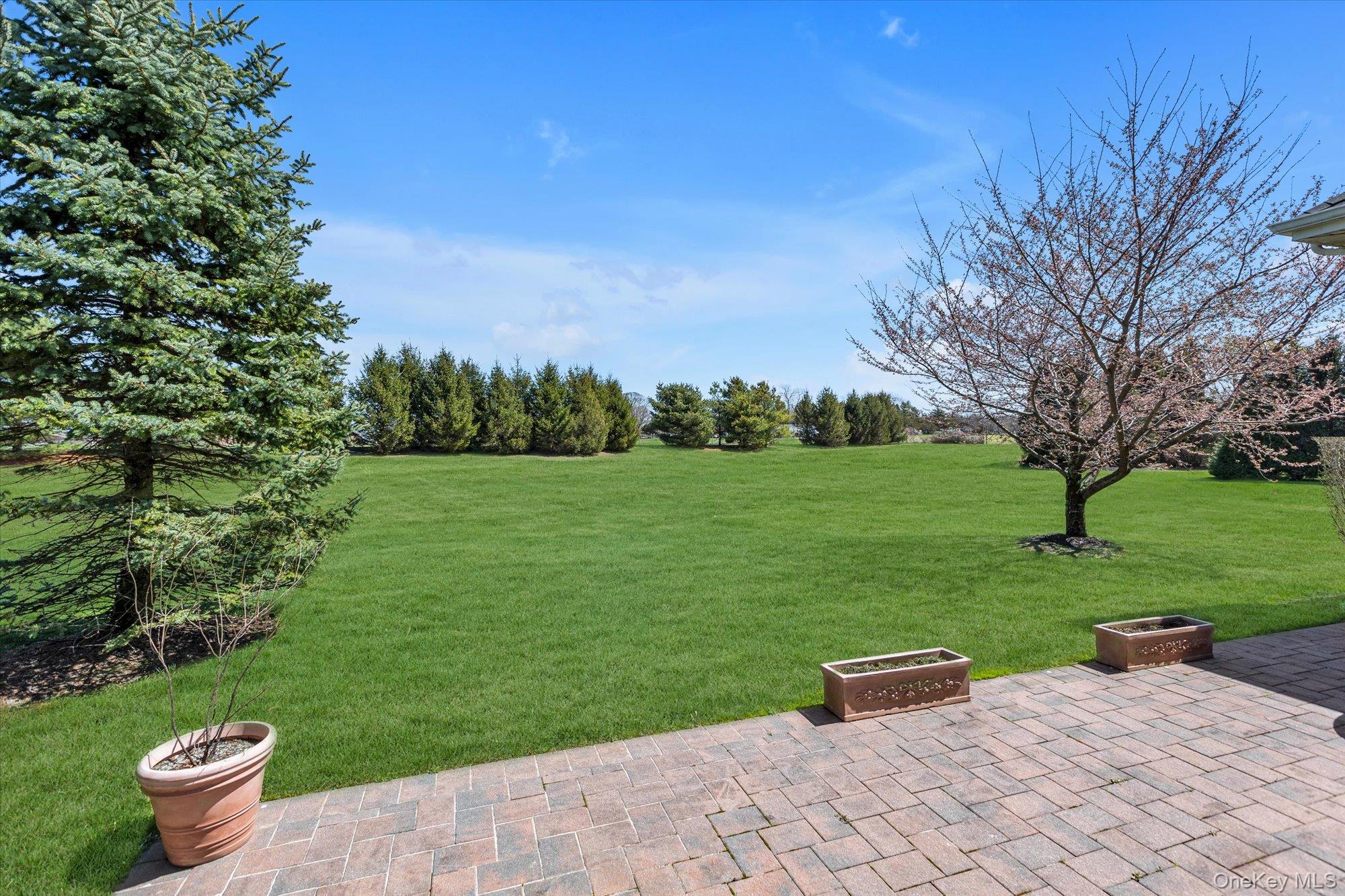 390 Stonecrop Road Riverhead, NY 11901 - Photo 21 of 24 a view of a patio with a yard