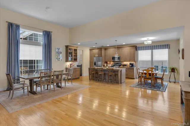 a living room with lots of furniture and kitchen view