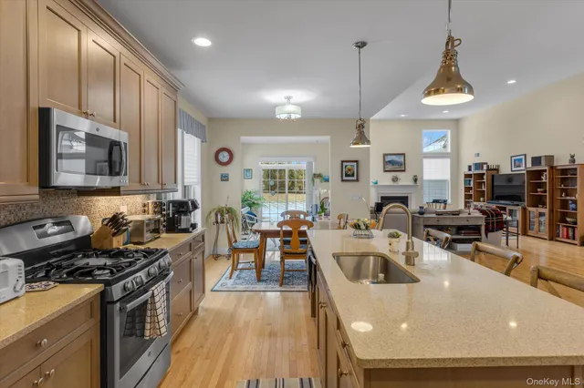 a view of a house with a yard and sitting area
