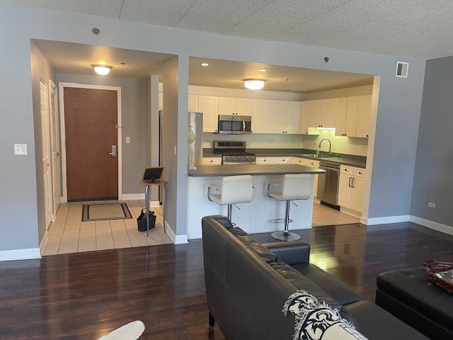 875 East 22nd Street, Unit 204 Lombard, IL 60148 - Photo 22 of 47 a kitchen with a table chairs and a couch
