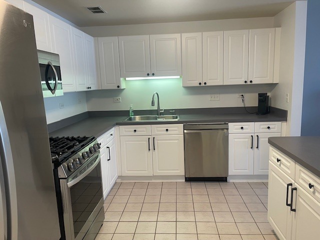 875 East 22nd Street, Unit 204 Lombard, IL 60148 - Photo 23 of 47 a kitchen with a stove sink and cabinets