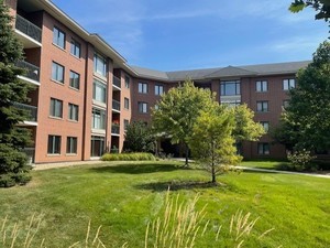 875 East 22nd Street, Unit 204 Lombard, IL 60148 - Photo 4 of 47 a view of a building with a yard