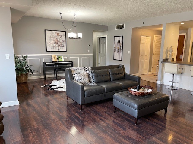 875 East 22nd Street, Unit 204 Lombard, IL 60148 - Photo 6 of 47 a living room with furniture and a wooden floor