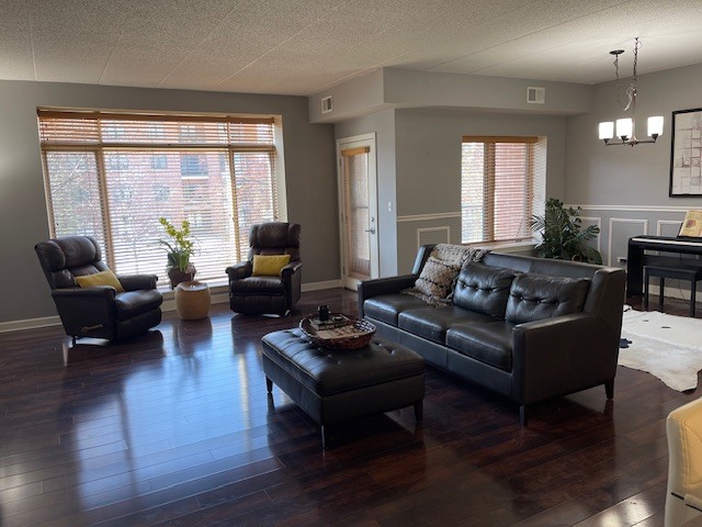 875 East 22nd Street, Unit 204 Lombard, IL 60148 - Photo 7 of 47 a living room with furniture and a large window