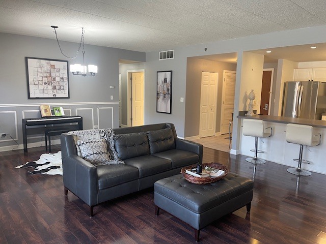 875 East 22nd Street, Unit 204 Lombard, IL 60148 - Photo 9 of 47 a living room with furniture and wooden floor