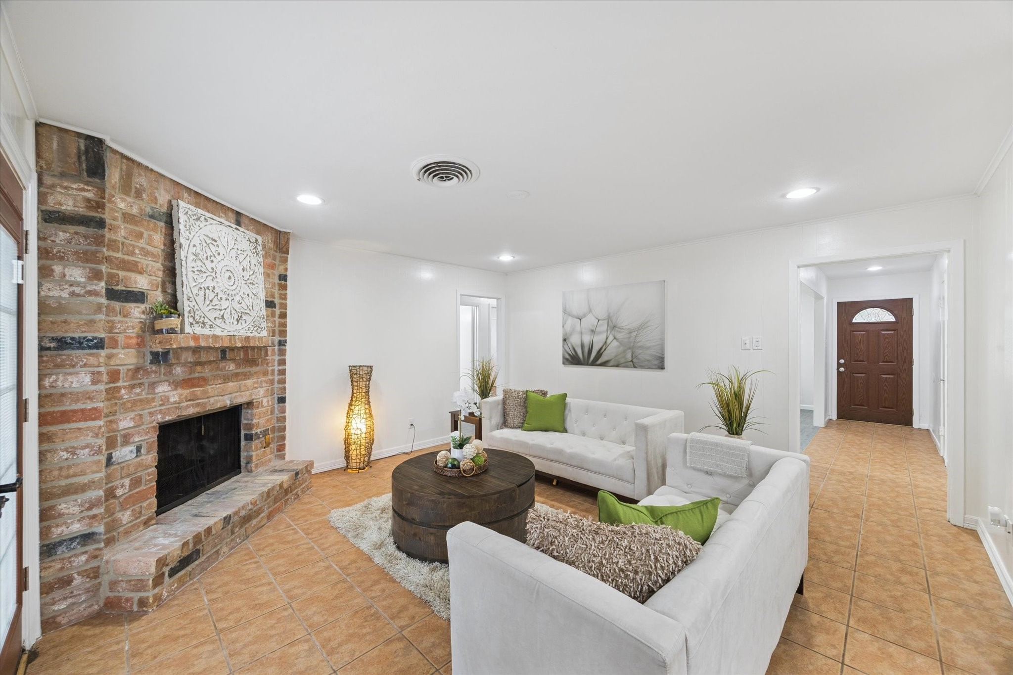 7539 Jason Street Houston, TX 77074 - Photo 2 of 16 a living room with furniture and a fireplace