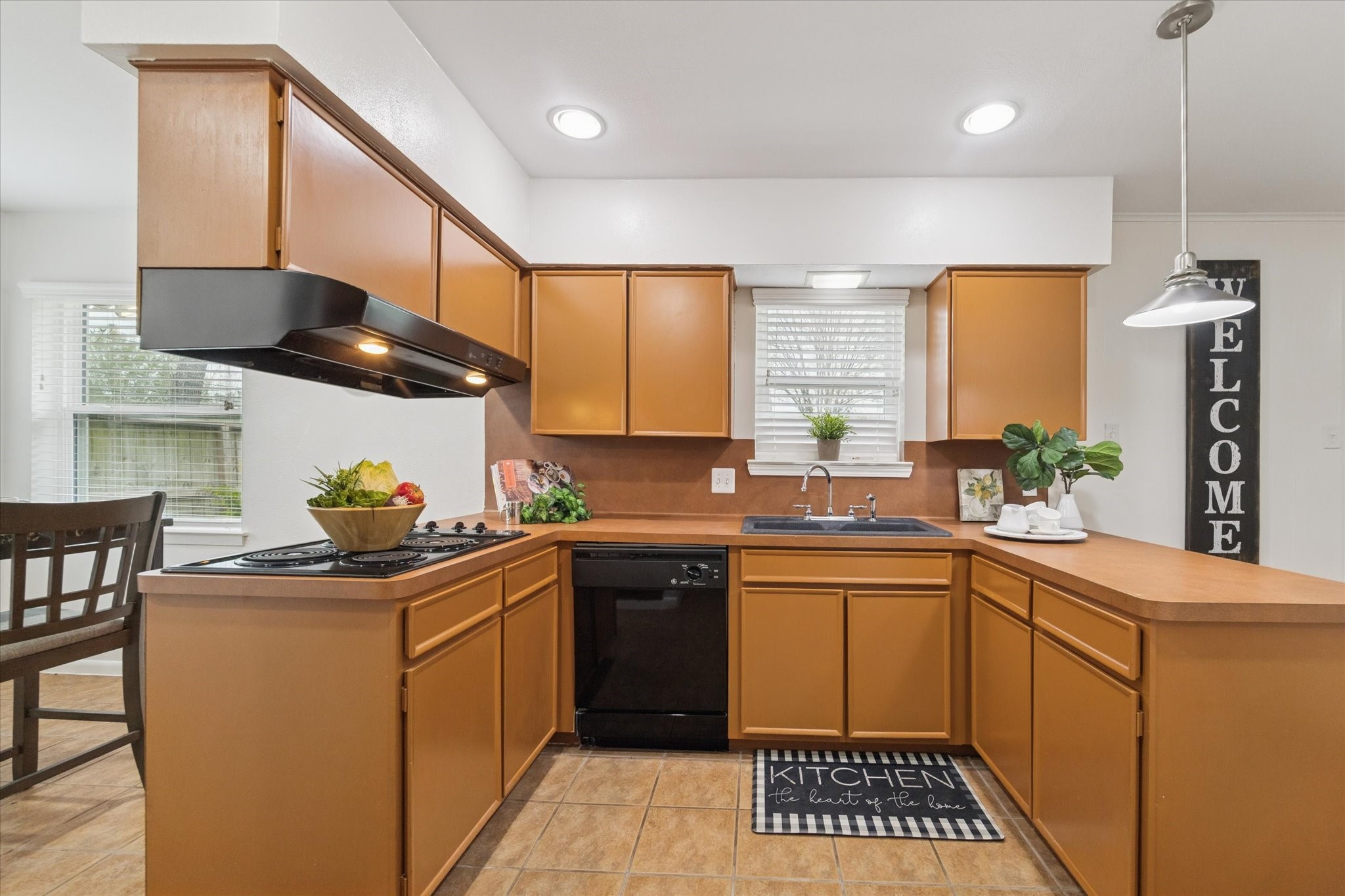 7539 Jason Street Houston, TX 77074 - Photo 7 of 16 a kitchen with stainless steel appliances a sink a stove and cabinets