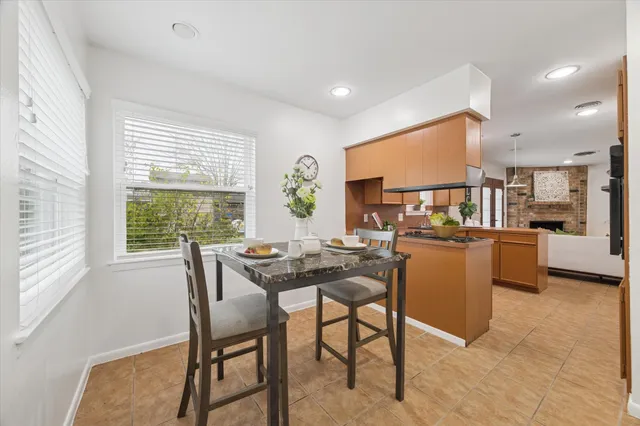 a view of a dining room with furniture window and outside view