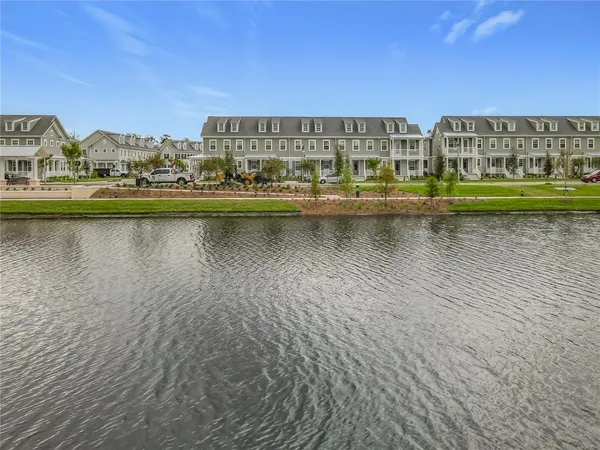 a view of a lake with building in front of it