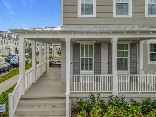 a view of a brick house with large windows