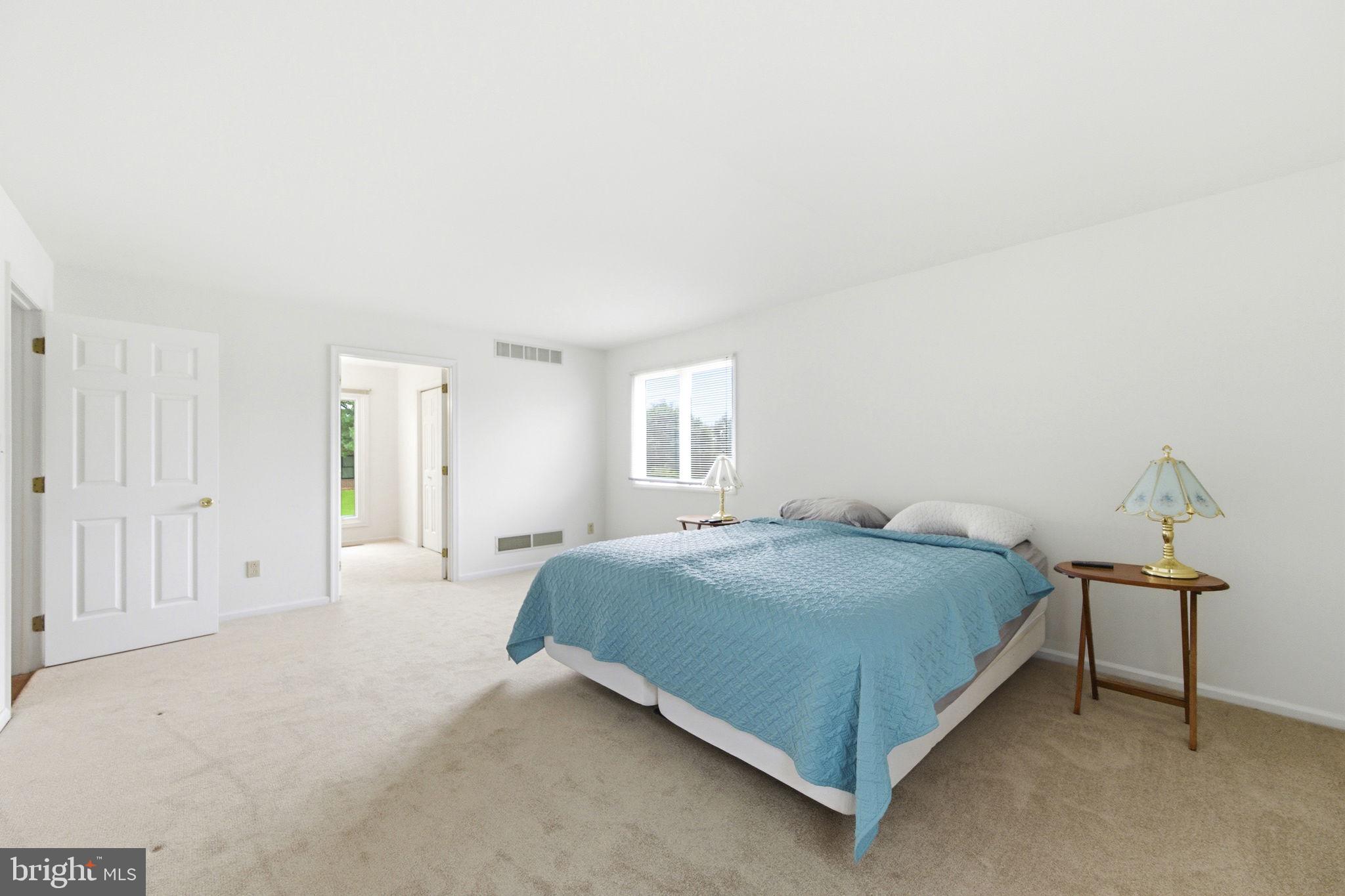 736 Letitia Drive Hockessin, DE 19707 - Photo 20 of 92 a bedroom with a bed and a lamp