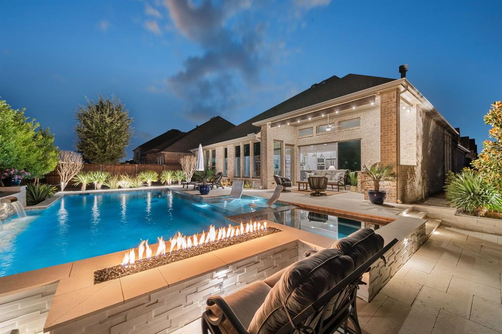 a view of a swimming pool with outdoor seating