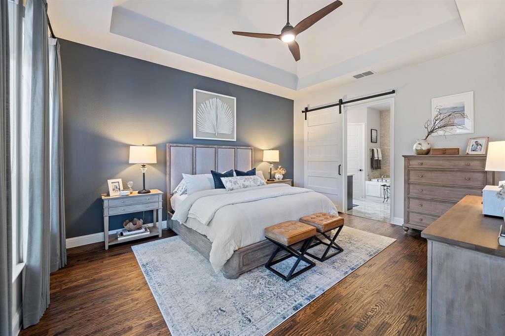 16509 Prairie Oak Road Frisco, TX 75033 - Photo 16 of 39 a bedroom with a bed and wooden floor