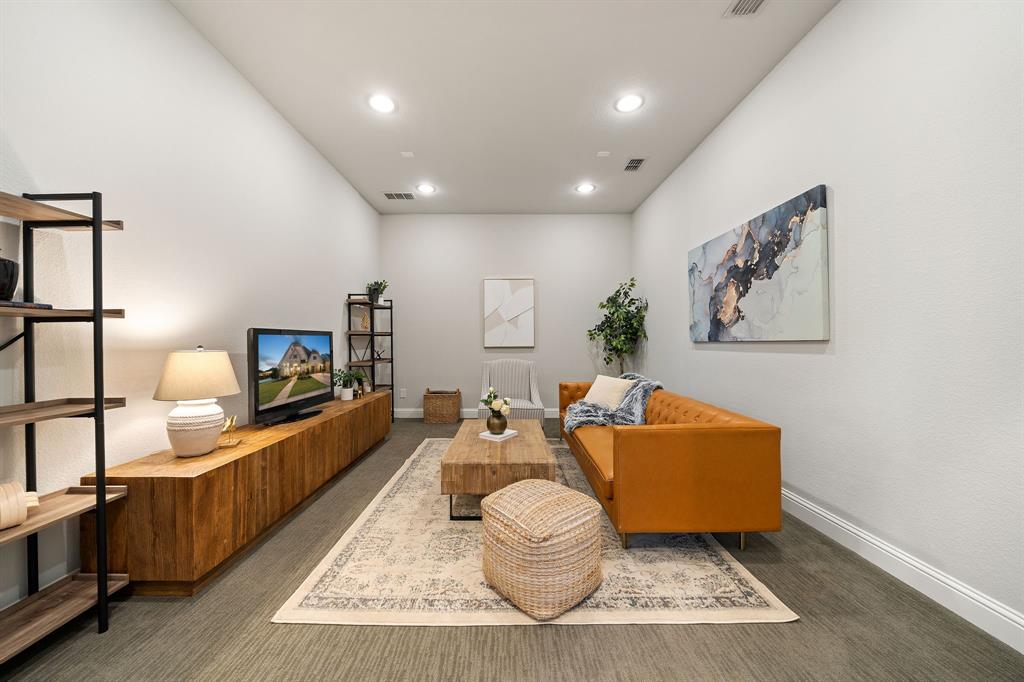 16509 Prairie Oak Road Frisco, TX 75033 - Photo 19 of 39 a living room with furniture and a wooden floor